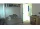 Cozy bedroom featuring a closet and an adjacent bathroom at 5681 Bidwell Pkwy # 104, Sarasota, FL 34233
