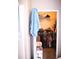 Walk-in closet featuring shelving, hanging rods, and neatly organized clothing at 5681 Bidwell Pkwy # 104, Sarasota, FL 34233