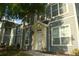 Two-story condo with neutral siding and white trim at 5681 Bidwell Pkwy # 104, Sarasota, FL 34233