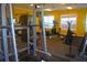 Well-equipped fitness center featuring a variety of weightlifting equipment, weights, and cardio machines at 5681 Bidwell Pkwy # 104, Sarasota, FL 34233