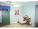 Charming office area with desk, artwork, and wood-look vinyl floors at 5681 Bidwell Pkwy # 104, Sarasota, FL 34233