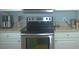 Close up on the range in kitchen with stainless steel appliances at 5681 Bidwell Pkwy # 104, Sarasota, FL 34233