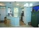 Bright kitchen with stainless steel appliances and bar seating area at 5681 Bidwell Pkwy # 104, Sarasota, FL 34233