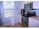 Well-equipped kitchen with stainless steel appliances and ample counter space at 5681 Bidwell Pkwy # 104, Sarasota, FL 34233