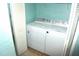This laundry room has a washer and dryer tucked behind a closet door at 5681 Bidwell Pkwy # 104, Sarasota, FL 34233