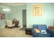 Cozy living room featuring ample sunlight, modern decor, and comfortable seating at 5681 Bidwell Pkwy # 104, Sarasota, FL 34233