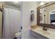 Well-lit bathroom with marble countertops, a new vanity, a large mirror, and a shower at 613 E 49Th E St, Bradenton, FL 34208