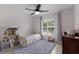 Charming bedroom with a dollhouse and a comfortable single bed at 613 E 49Th E St, Bradenton, FL 34208