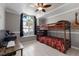 Cozy bedroom with a large window and a bunk bed, perfect for children at 613 E 49Th E St, Bradenton, FL 34208