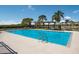 Community pool with clear blue water, gazebo, and surrounding landscaping, ideal for relaxation at 613 E 49Th E St, Bradenton, FL 34208