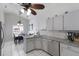 Bright kitchen features stainless appliances, stone countertops, and adjoins the dining area at 613 E 49Th E St, Bradenton, FL 34208