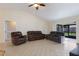 Open living room area featuring three sofas and access to the outdoor lanai at 613 E 49Th E St, Bradenton, FL 34208