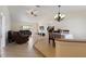Inviting living room featuring comfortable seating, an open floor plan, and an adjacent dining area at 613 E 49Th E St, Bradenton, FL 34208