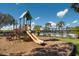 Playground featuring a slide, climbing structure, and view of the pool at 613 E 49Th E St, Bradenton, FL 34208