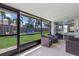Relaxing screened lanai overlooking a spacious backyard with play equipment at 613 E 49Th E St, Bradenton, FL 34208