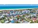 Beautiful aerial view of a coastal home near white sand beaches and turquoise waters, highlighting its prime location at 643 Calle Del Otono, Sarasota, FL 34242