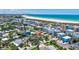 Stunning aerial view of a beachside community, showcasing its proximity to the coast and lush greenery at 643 Calle Del Otono, Sarasota, FL 34242