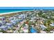 Aerial view of the home's location near the beach with ocean views and lush landscaping at 643 Calle Del Otono, Sarasota, FL 34242