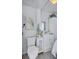 Small bathroom with a toilet, vanity, sink, and an art print of a bird on the wall at 643 Calle Del Otono, Sarasota, FL 34242