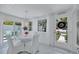 Light-filled dining area with white furnishings and views of the outdoors, creating an inviting atmosphere at 643 Calle Del Otono, Sarasota, FL 34242