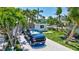 Well-maintained home with mature trees and a paved driveway at 643 Calle Del Otono, Sarasota, FL 34242