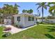 Well-kept home with verdant lawn and lush tropical landscaping at 643 Calle Del Otono, Sarasota, FL 34242
