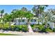 Charming home surrounded by tropical landscaping and well-manicured green spaces at 643 Calle Del Otono, Sarasota, FL 34242