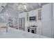 Well-lit kitchen offers white cabinets, stainless steel appliances, and an open layout, perfect for modern living at 643 Calle Del Otono, Sarasota, FL 34242