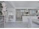 Bright kitchen with white cabinetry seamlessly connects to the dining area, creating an inviting open space at 643 Calle Del Otono, Sarasota, FL 34242