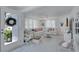 Inviting living room featuring white decor, comfortable seating, and natural light at 643 Calle Del Otono, Sarasota, FL 34242