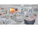 Spacious living room with coastal decor, open layout, and herringbone floors at 643 Calle Del Otono, Sarasota, FL 34242