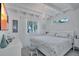 Tranquil bedroom with a queen bed, ample natural light, and views of the surrounding greenery at 643 Calle Del Otono, Sarasota, FL 34242
