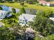 Stunning aerial view of a home nestled beside a serene lake and a lush golf course at 6572 Fairway Gardens Dr # 6572, Bradenton, FL 34203