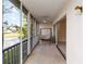Relaxing screened balcony with a swing and scenic lake views, perfect for enjoying the outdoors at 6572 Fairway Gardens Dr # 6572, Bradenton, FL 34203