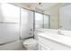 Bathroom features a toilet, shower/tub combo, vanity, and a large mirror at 6572 Fairway Gardens Dr # 6572, Bradenton, FL 34203