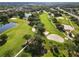 Lush golf course with scenic water hazards and mature trees at 6572 Fairway Gardens Dr # 6572, Bradenton, FL 34203