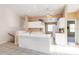 Open concept kitchen with a ceiling fan and plenty of counter space at 6572 Fairway Gardens Dr # 6572, Bradenton, FL 34203