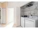 Laundry room featuring tiled floor and appliances at 6572 Fairway Gardens Dr # 6572, Bradenton, FL 34203