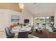 Staged living room and dining area with views of the golf course at 6572 Fairway Gardens Dr # 6572, Bradenton, FL 34203