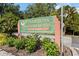 Entrance sign to Fairway Gardens at Tara surrounded by vibrant landscaping at 6572 Fairway Gardens Dr # 6572, Bradenton, FL 34203