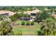 Expansive backyard with a pool, mature landscaping, and a screened-in lanai offering serene outdoor living at 6808 Belmont Ct, Lakewood Ranch, FL 34202