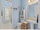 Cozy blue bathroom featuring charming nautical decor and a glass-doored shower at 6808 Belmont Ct, Lakewood Ranch, FL 34202