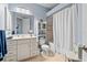 Bright bathroom featuring a shower, vanity, and tile flooring at 6808 Belmont Ct, Lakewood Ranch, FL 34202