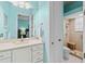 Bright bathroom with white cabinets, quartz countertops and tiled shower stall at 6808 Belmont Ct, Lakewood Ranch, FL 34202