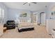 Comfortable bedroom with chair, ceiling fan, and carpeted floor at 6808 Belmont Ct, Lakewood Ranch, FL 34202