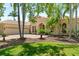 Attractive home featuring a tile roof, three-car garage, and verdant lawn at 6808 Belmont Ct, Lakewood Ranch, FL 34202