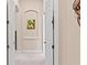 Clean hallway with access to various rooms of the house; art displayed at 6808 Belmont Ct, Lakewood Ranch, FL 34202