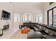 Relaxing living room featuring a fireplace and views through shuttered windows at 6808 Belmont Ct, Lakewood Ranch, FL 34202