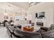 Open-concept living room with fireplace flows seamlessly to the kitchen and dining area, ideal for entertaining at 6808 Belmont Ct, Lakewood Ranch, FL 34202