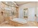 Luxurious main bathroom features a soaking tub, walk-in shower, and and walk-in closet at 6808 Belmont Ct, Lakewood Ranch, FL 34202